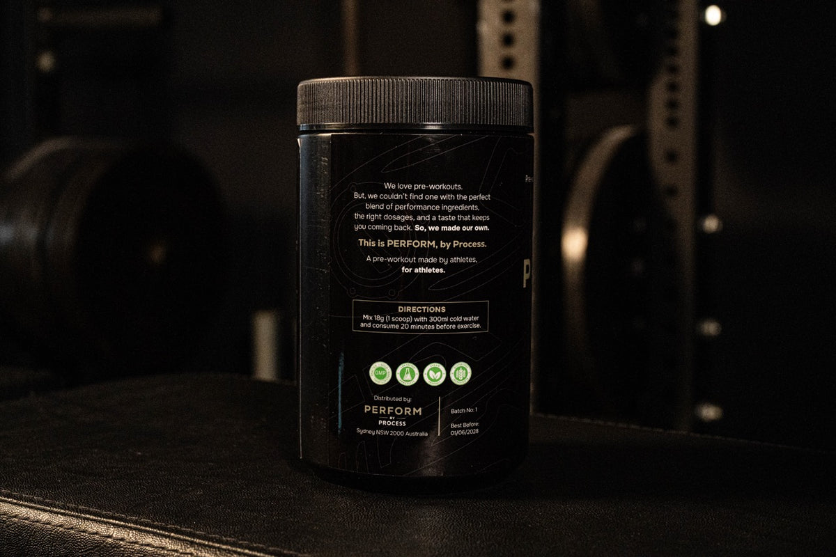 Black supplement container with text and icons on a dark background